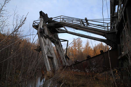 The remains of delelict mining dredge outside of Dawson City,