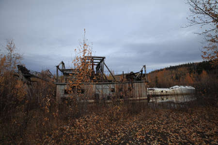 The remains of delelict mining dredge outside of Dawson City,