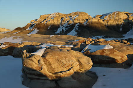 Striped rock eggs with sandstone at dawn, Bisti Badlands, De-Nah-Zin Wilderness Area, New Mexico,...