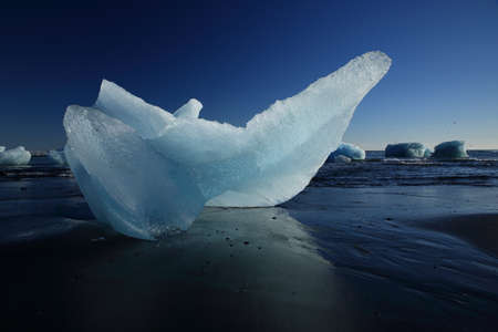 Glacier ice chunks on the black beach at Jokulsarlon Iceland
