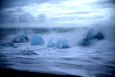 Glacier ice chunks on the black beach at Jokulsarlon