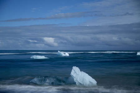 Glacier ice chunks on the black beach at Jokulsarlonの写真素材