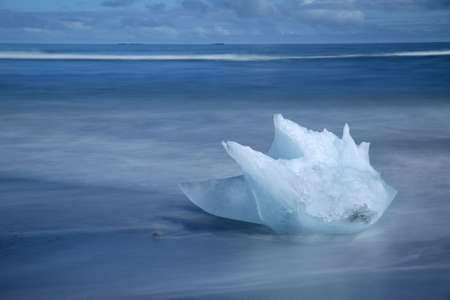 Glacier ice chunks on the black beach at Jokulsarlon
