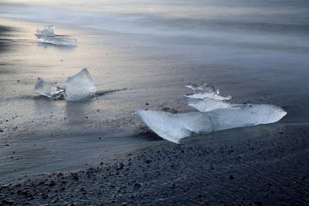 Glacier ice chunks on the black beach at Jokulsarlon