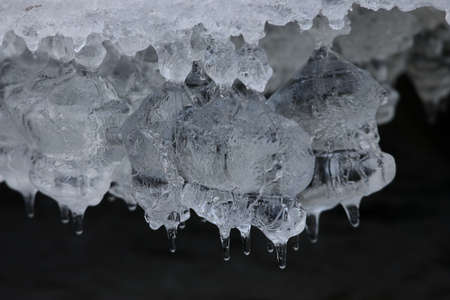 Frozen ice formations on a winter stream, Saxony Germany