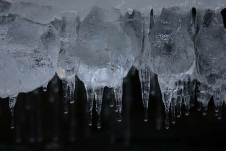 Frozen ice formations on a winter stream, Saxony Germany