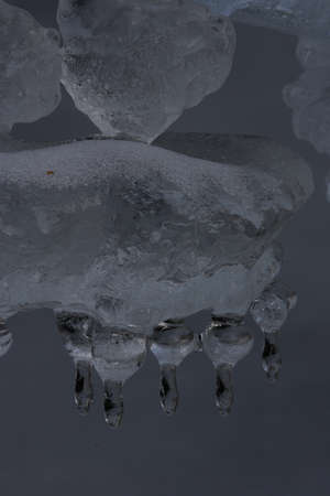 Frozen ice formations on a winter stream, Saxony Germany