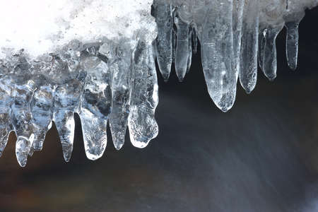 Frozen ice formations on a winter stream, Saxony Germany