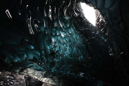 Ice cave at the northern shore of glacial lagoon Joekulsarlon in glacier Breidamerkurjoekull in Vatnajoekull NP. Europe, Northern Europe, Icelandの写真素材