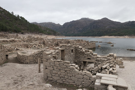 The ruins of Vilarinho da Furna during the dry season, when the former-village becomes exposed Peneda-Geres Portugalの写真素材