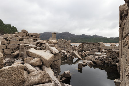 The ruins of Vilarinho da Furna during the dry season, when the former-village becomes exposed Peneda-Geres Portugalの写真素材