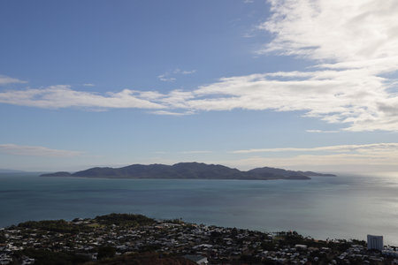 Urban environmental scene atop Castle Hill in Townsville, with Magnetic Island on the horizonの写真素材