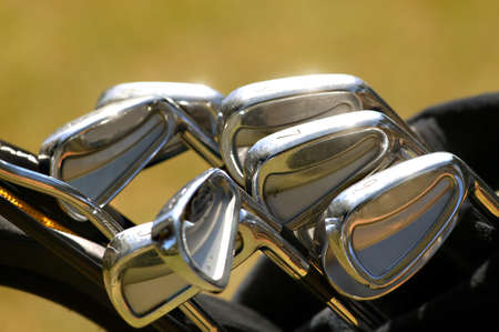 Seven golf iron or golf clubs in the light. Seven golf irons or golf clubsの写真素材