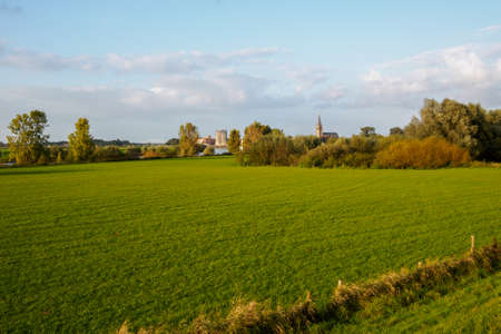 Overlooking fields and a river with a view of Doesburgの写真素材
