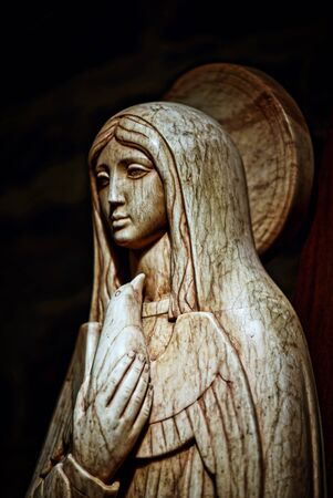 Marble sculpture of the Virgin Mary holding a dove in her right handの写真素材