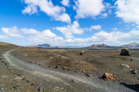 Gravel track in the Caldera Colorada, Lanzarote, Canary islands, Spainの写真素材