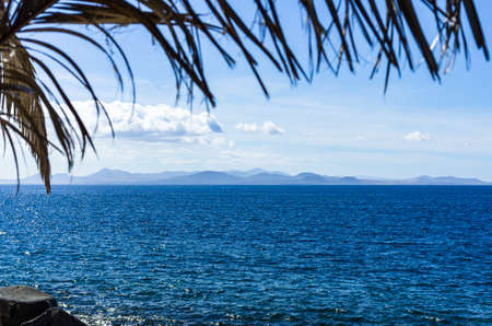 View from Playa Blanca, Lanzarote, to the island of Fuerteventuraの写真素材