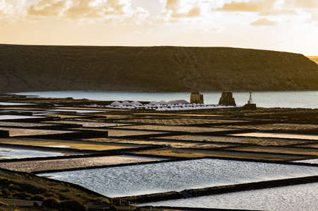 Salinas de Janubio in the evening sun, Lanzarote, Canary islands, Spainの写真素材