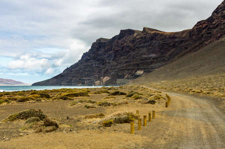 View to the Risco de Famara from the Playa de Famara in the northwest of Lanzaroteの写真素材