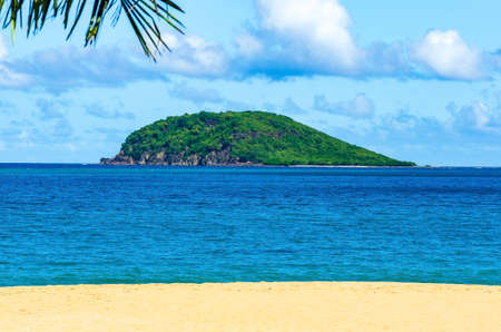 Small island off the coast of Guadeloupe, beach in foregroundの写真素材