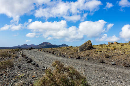 Gravel track in the Caldera Colorada, Lanzarote, Canary islands, Spainの写真素材