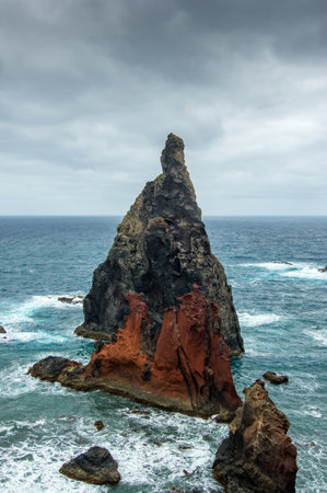 Great boulder in the atlantic ocean at the shore of the peninsula Ponta do Sao Lourenco, dramatic sky, Madeiraの写真素材
