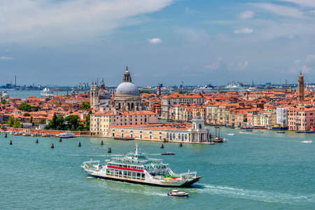 VENICE, VENETO - ITALY - JULY 16 2018: Santa Maria della Salute with canal grande in venice