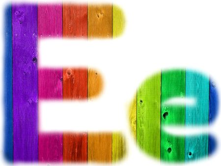 The letter E with a wooden rainbow backgroundの写真素材