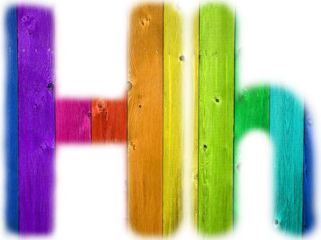 The letter H with a wooden rainbow backgroundの写真素材