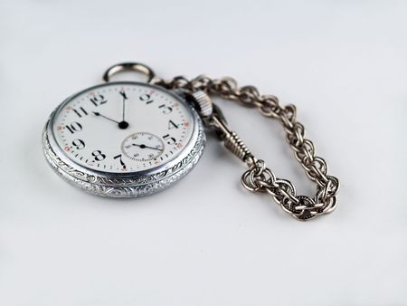 Silver Pocket Watch on a chain isolated on Grayの写真素材