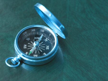 Brass Compass on an old cherrywood tableの写真素材
