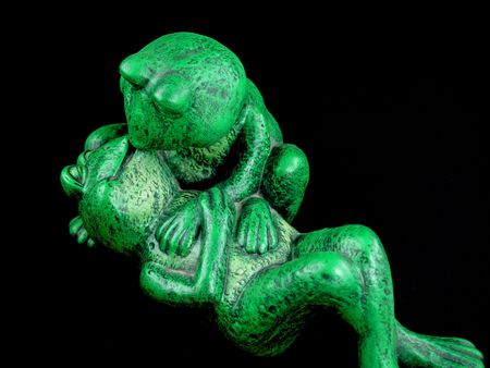 Two Green Frogs in a Romantic Embrace Statueの写真素材