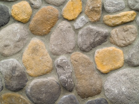 Rock and Concrete Wall with Large Rounded Stones