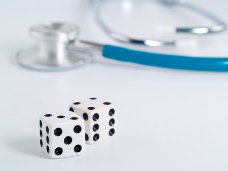 Stethoscope and Dice as a Gambling with your Health Conceptの写真素材