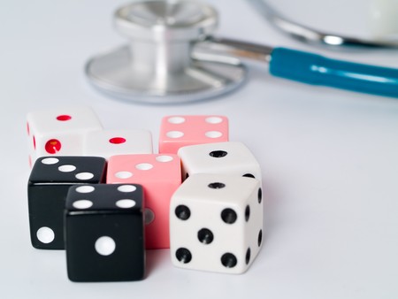 Stethoscope and Dice as a Gambling with your Health Conceptの写真素材