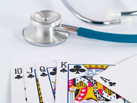 Stethoscope and Playing Cards as a Gambling with your Health Conceptのeditorial素材
