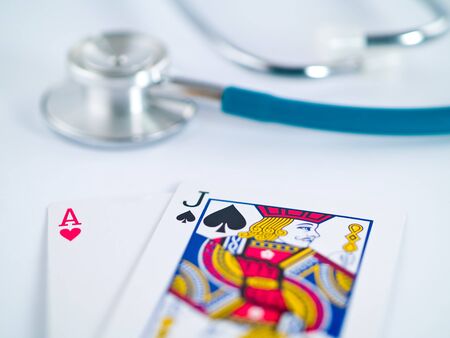 Stethoscope and Playing Cards as a Gambling with your Health Conceptのeditorial素材