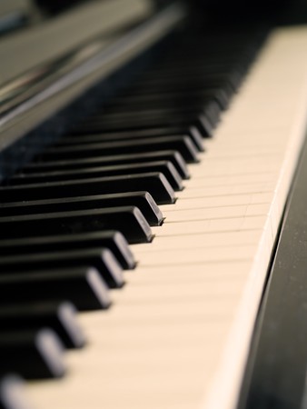 Piano keys of a very well loved and often played piano の写真素材