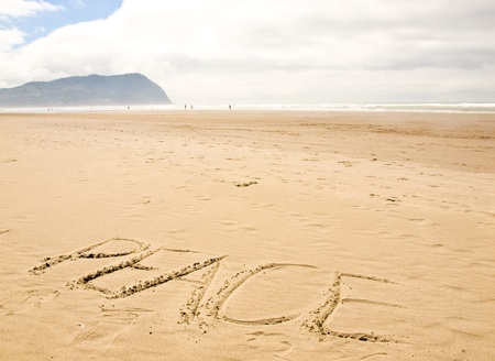 Peace Written in the Sand on a Sunny Dayの写真素材
