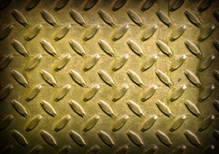 Diamond Gold Toned Metal Background Texture with Dark Edgeの写真素材