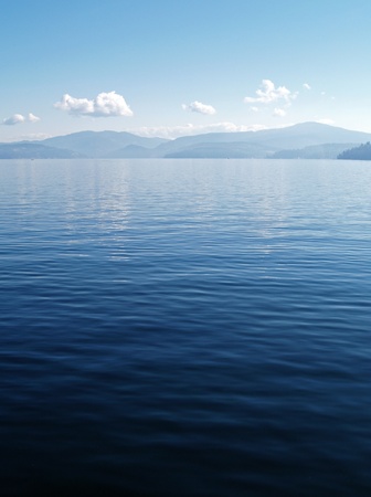 A Mountain Lake Under a Deep Blue Sky Coeur d'Alene Idaho USAの写真素材
