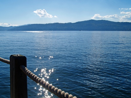 A Mountain Lake Under a Deep Blue Sky from a Roped Path Coeur d'Alene Idaho USAの写真素材