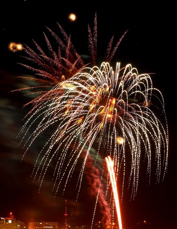 Fireworks Against the Night Sky of a Cityscapeの写真素材