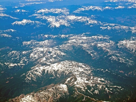 View of a Snowcapped Mountain Landscape from an Airplaneの写真素材