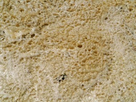 Seafoam Texture Background Left on the Beach by Waves