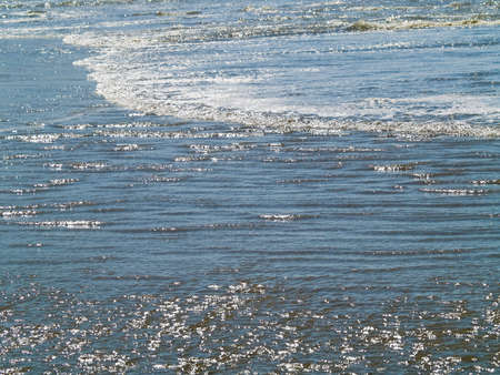 Ocean Waves and Ripples Gently Rolling on the Shoreline