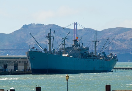 Golden Gate Bridge Behind a Large Ship as Seen from Pier 39 in San Francisco California USAのeditorial素材