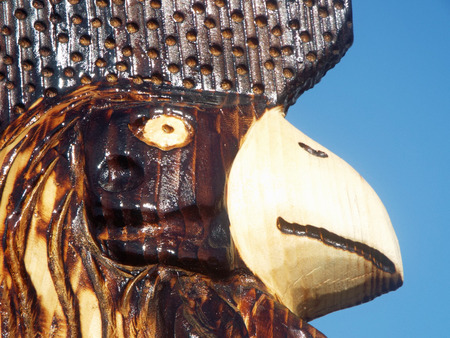 Carved and Burned Wood Chainsaw Sculpture of a Chickenの写真素材