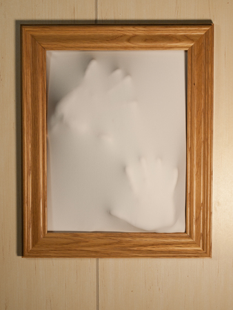 Creepy Picture Frame with Something Coming Out of Itの写真素材