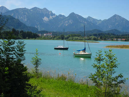 Sailing boats at the Forggensee in Bavaria - Germanyの写真素材
